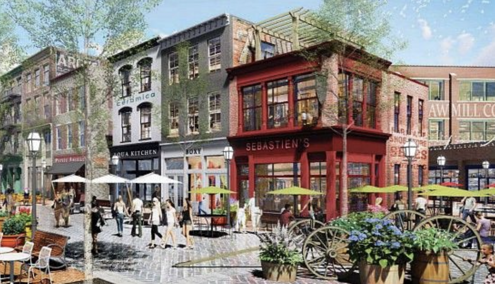 attractive buildings with residential apartments over retail with wide walkable sidewalks.